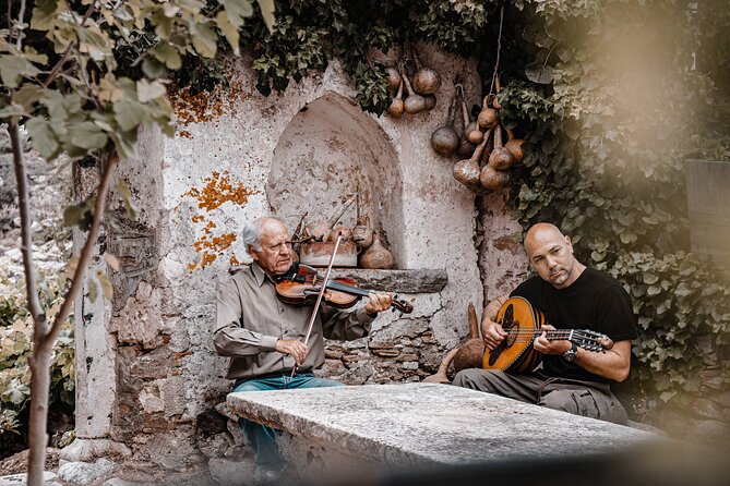 Cooking Experience Live Music and Traditional Dance in Naxos - Arriving at Flerio beside the Melanes Kouros
