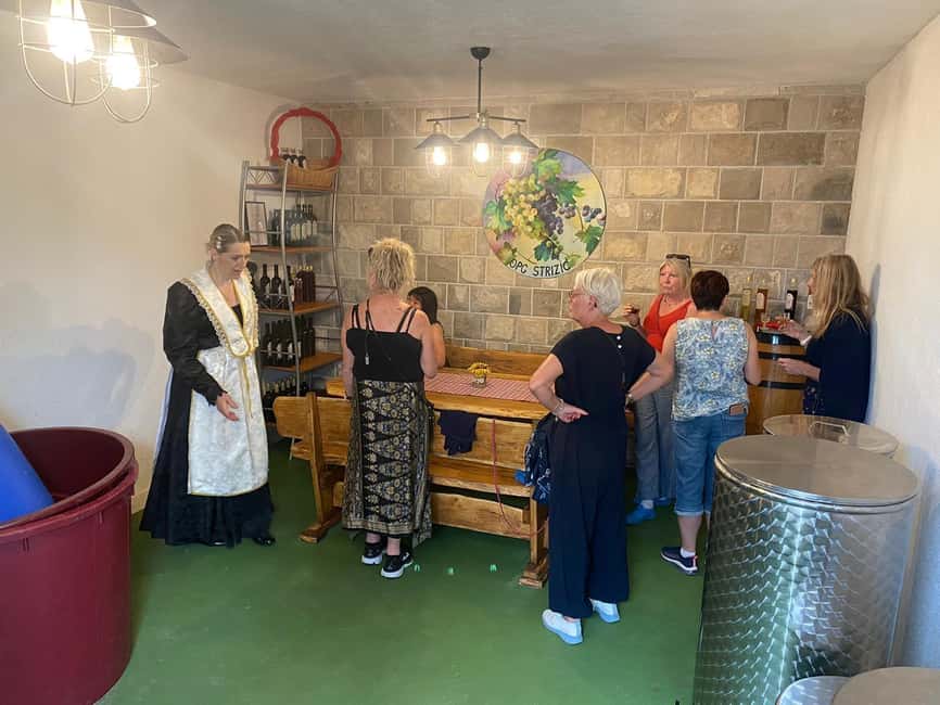 Kastela: Wine & Olive Tasting Tour w/Delicacies & Live Music - A generous Dalmatian table under the pergola
