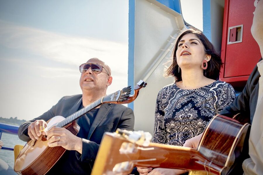Lisbon: Boat Cruise with Live Fado Performance and a Drink - Boat comfort, wind, and the view