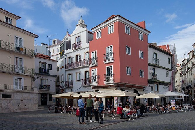 Lisbon Food Tour with 3 Stops and Fado Show Performance - Walking through Alfama and central Lisbon