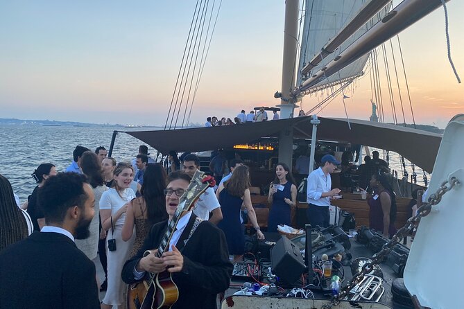 New York City Sunset Jazz Sail aboard Clipper City - Passing the waterfront park and Ellis Island