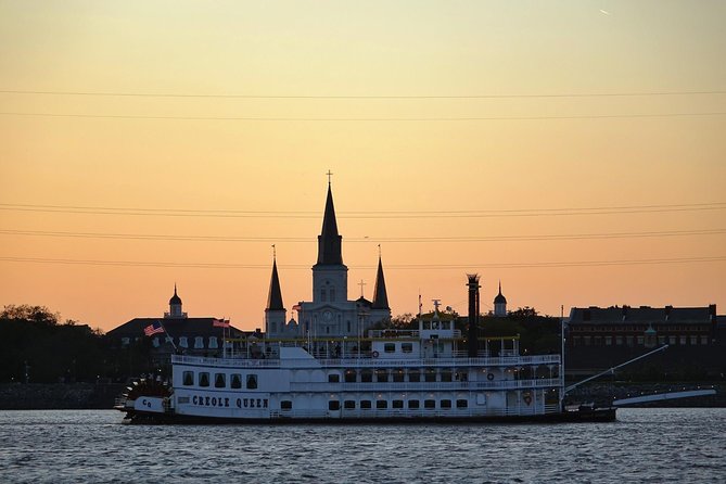 Paddlewheeler Creole Queen Jazz Dinner Cruise in New Orleans - A paddlewheeler setting with a working river view