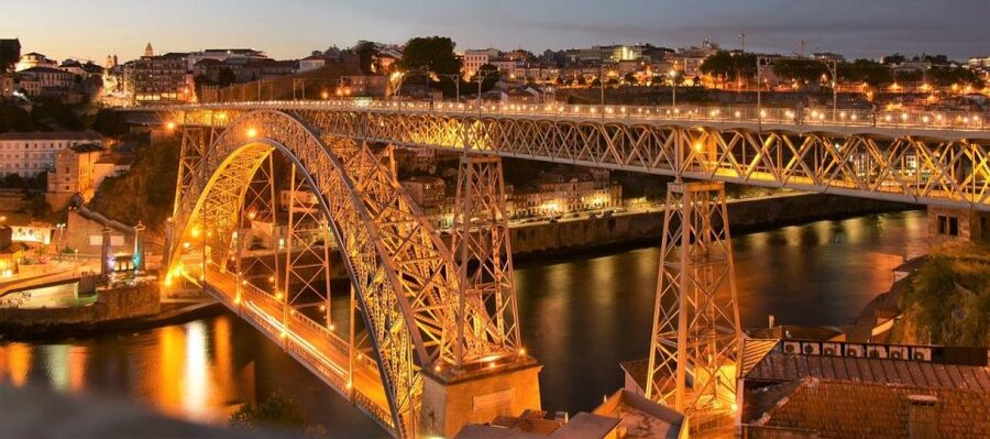 Porto Fado Night Show + Dinner - Dinner with Porto lights below