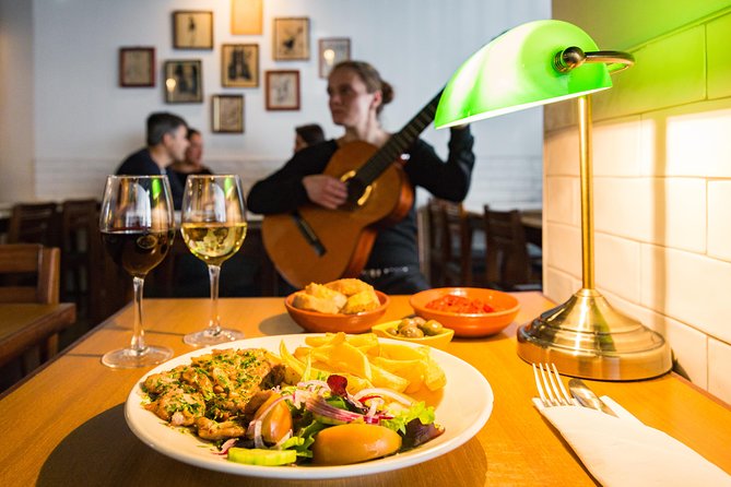 Private Tour: Lisbon Sunset Walking Tour with Fado Show and Dinner - Mouraria, ginjinha, and the roots of Fado