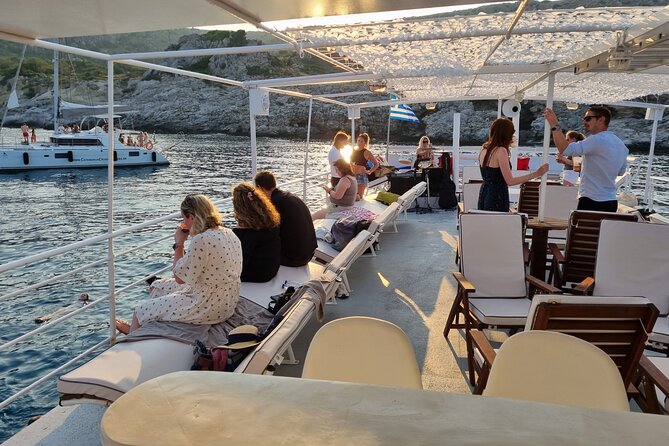 Rhodes Sunset Cruise - Swim and Dine w/ Live Music & Sunset! - Live guitar, group singing, and a relaxed return