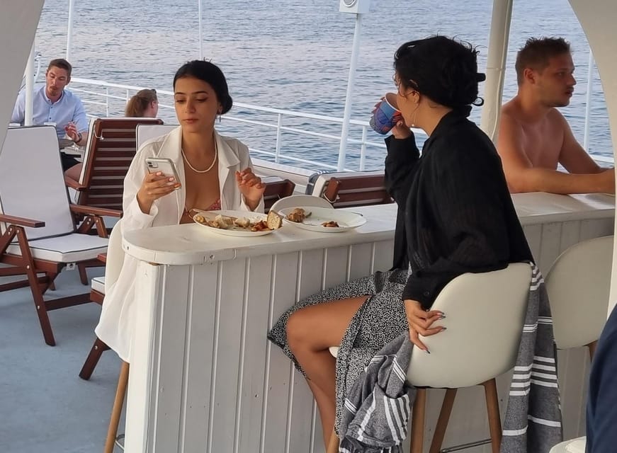 Rhodes: Sunset Cruise with Live Music, Wine & Greek Buffet - Leaving Mandraki Port near Rhodes Old Town