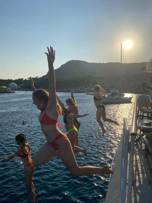 Rhodes: Sunset Cruise with Open Bar, Dinner, & Live Music - Cruising past Rhodes Town’s waterfront sights