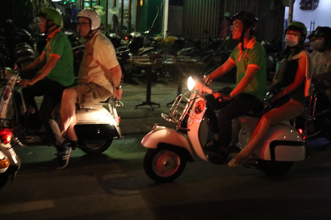 Saigon After Dark Vespa Street Food Tour + Live Music 4 hours - Banh xeo, nem lui, and the next food stop