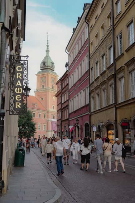 Warsaw: Guided Walking Tour with a Private Chopin Concert - Old Town stories, narrow streets, and medieval defenses
